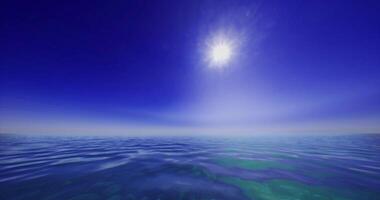 CGI Serene ocean view under bright sun at midday with clear blue skies video