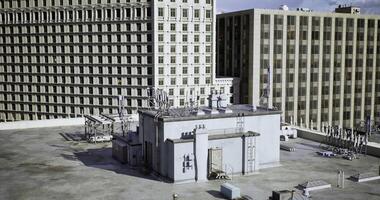 CGI Roof top view of urban buildings with antennas and structures in daylight video