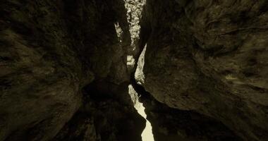CGI Exploring the narrow canyon with light filtering through high rock walls video
