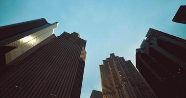 CGI Views from below the towering buildings in the downtown area during twilight video