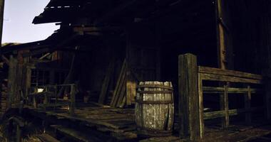 CGI Old wooden structure with barrel and deteriorating porch detail at dusk video