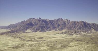CGI Majestic mountain range seen under clear blue sky during daytime video