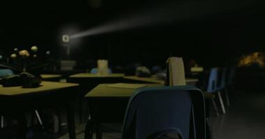 CGI Abandoned classroom setting with projection light in dim atmosphere video