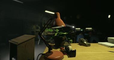 CGI Desk workspace with lamp and plant in a dimly lit classroom at night video