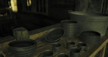CGI Historic kitchenware on display in a rustic setting with dim lighting video