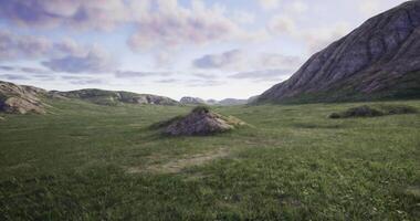 CGI Vast green landscape with rocky formations under a cloudy sky during midday video