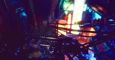 CGI Colorful neon lights illuminate the intricate machinery in a futuristic setting video