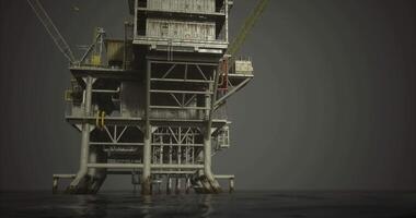 CGI Oil drilling platform stands tall over dark ocean waters under cloudy sky video