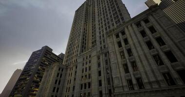 CGI Tall buildings loom under a cloudy sky in an urban setting during twilight video