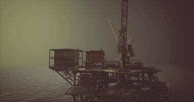 CGI Oil platform stands tall over calm waters during twilight hours video