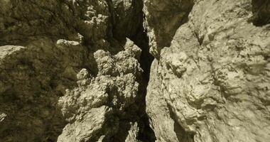 CGI Exploring a narrow canyon with rugged rock formations at midday video