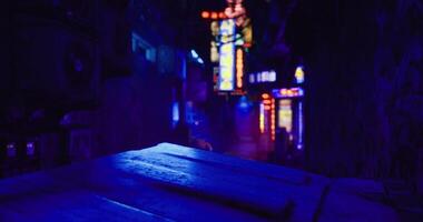 CGI Bright neon lights illuminate a narrow alley at night in an urban setting video