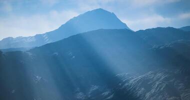 CGI Majestic mountain peak rising above misty valleys at dawn video