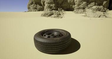 CGI Rustic tire rests in desert landscape near rocky formations video