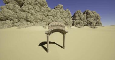 CGI Ruined architectural arch stands alone in a sandy desert landscape video