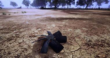 CGI Broken fan blade rests on cracked ground in remote landscape during daylight video