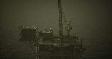 CGI Offshore oil rig during dusk with cranes and helicopter landing area visible video