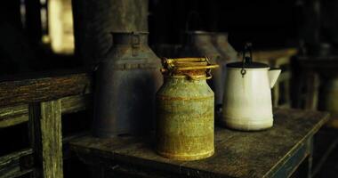 CGI Milk cans and a pitcher on a rustic barn table video
