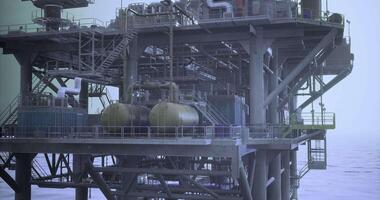 CGI Offshore oil rig with complex structure and operational equipment at dawn video