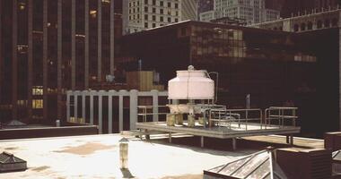 CGI Rooftop cooling tower in an urban setting with skyscrapers and sunlight video