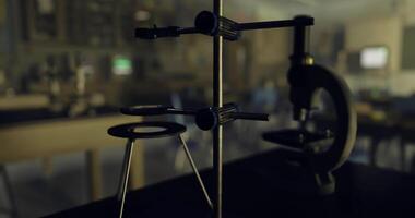 CGI Laboratory equipment arranged on a table in a science classroom setting video