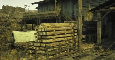 CGI Wooden structures and wagon by rustic building in desolate area video