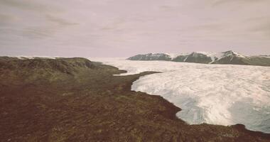 CGI Majestic glacier landscape with rocky terrain and mountains in distance video