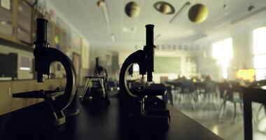 CGI Microscopes on lab table in a well lit classroom during school hours video