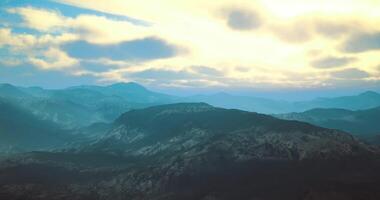 CGI Majestic mountain landscape with mist at dawn in a serene location video