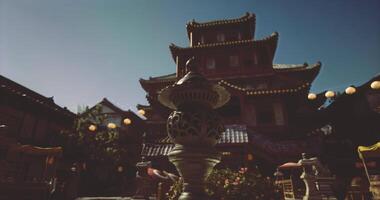 CGI Beautiful traditional architecture at dusk with lanterns and garden features video