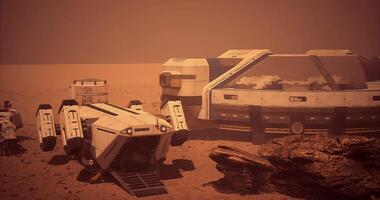 CGI Exploration base on the surface of Mars with robotic vehicles nearby video