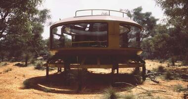 CGI Unique round house amidst sparse vegetation in arid landscape video