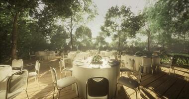 CGI Elegant outdoor dining setup in a serene garden setting during daylight video
