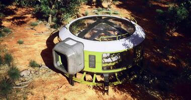 CGI Futuristic green circular structure blends into arid desert landscape video