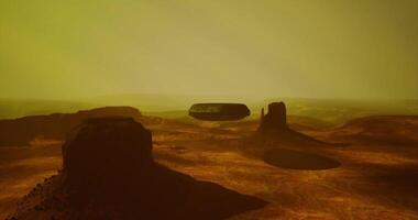 CGI UFO hovering over rocky terrain at twilight in a mysterious landscape video