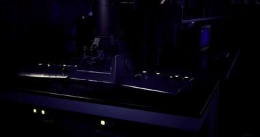 CGI Advanced laboratory equipment is illuminated in dark research facility video