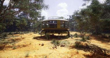 CGI Modern circular building surrounded by nature in a remote landscape video
