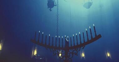 CGI Chandelier casting shadows in a dimly lit room with a mystical atmosphere video