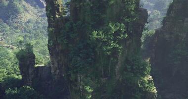 CGI Breathtaking view of lush green cliffs in a mountainous region during daylight video