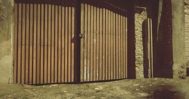 CGI Wooden gate with intricate design in a rustic urban setting video