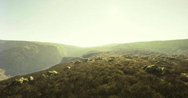 CGI Scenic view of lush hills and rocky landscape under bright sunlight video