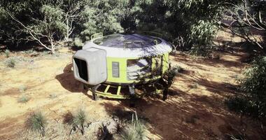 CGI Futuristic habitat situated in a remote forested area during daylight video