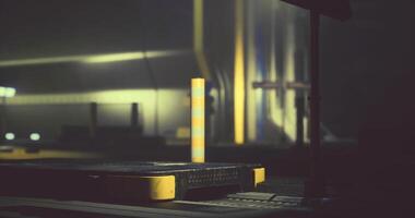CGI Industrial setting with yellow and gray platform illuminated in low light video