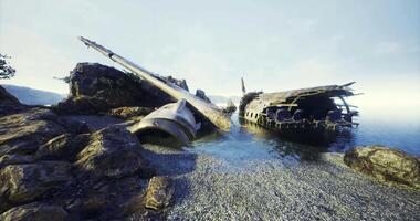 CGI Shipwreck rests on rocky shore with calm waters and distant hills in background video
