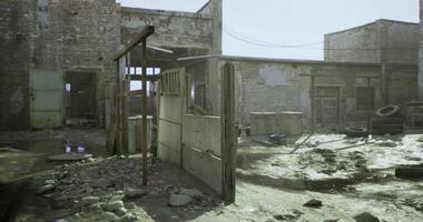 CGI Abandoned industrial site with deteriorated buildings and debris in sunlight video