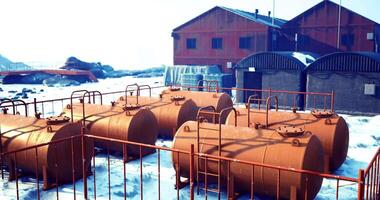 CGI Storage tanks and structures at an industrial site in a snowy landscape video