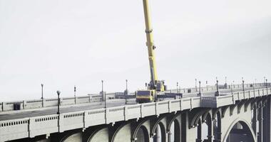 CGI Construction work underway on a bridge with a crane lifting heavy materials video