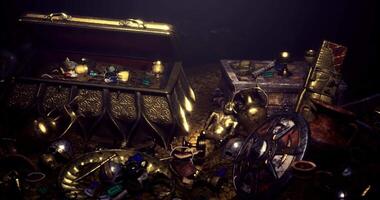 CGI Treasure trove filled with ancient artifacts and gleaming gems in a dark cave video