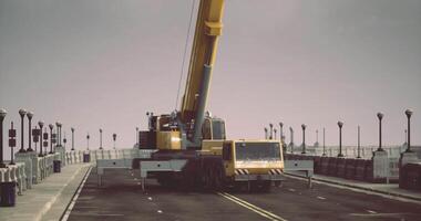 CGI Heavy machinery operates on a construction site near a waterfront area video