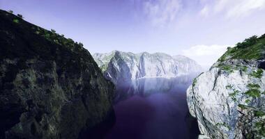 CGI Majestic cliffs reflecting in tranquil waters at a serene coastal location video
